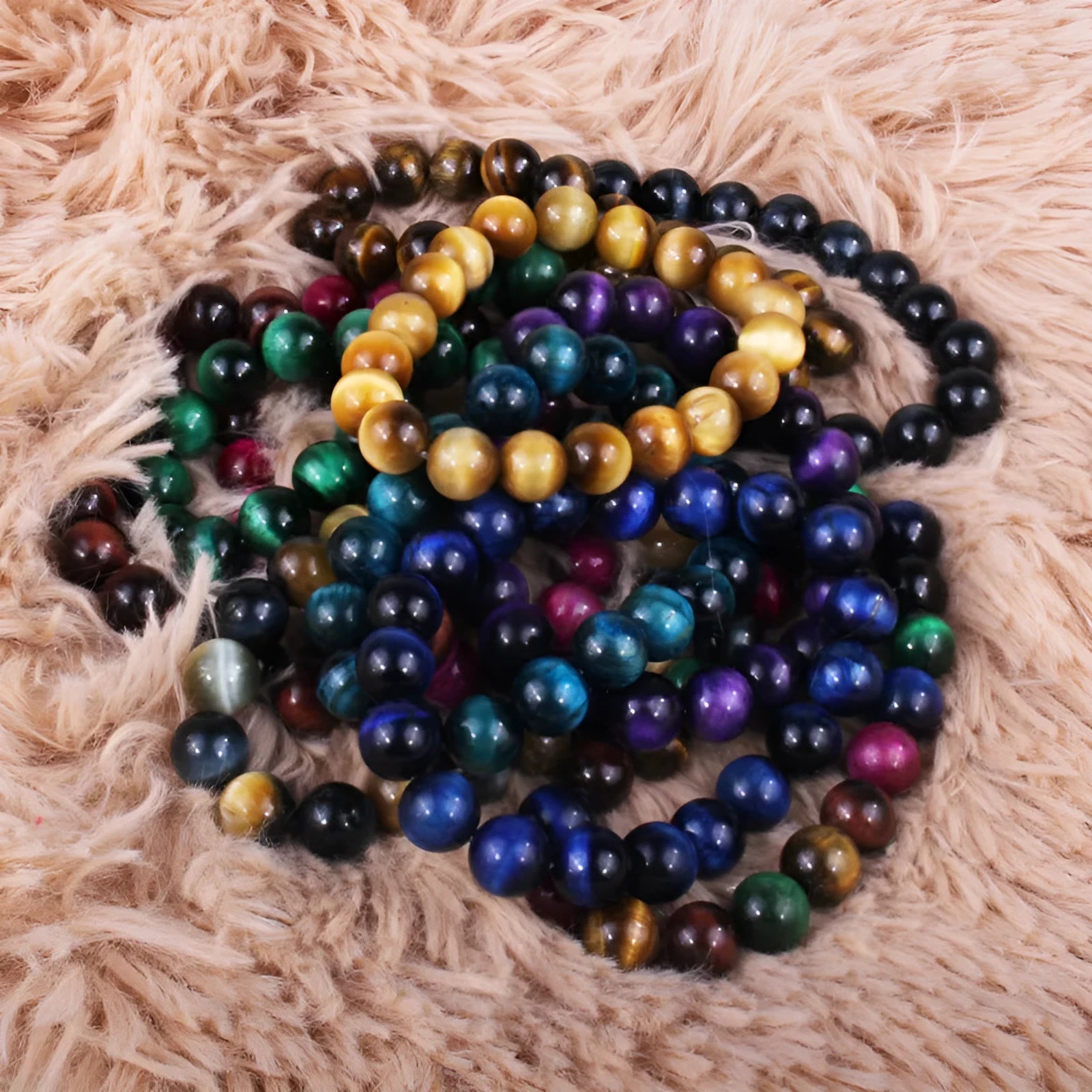 Natural tiger eye crystal beaded bracelet showing round beads in a choice of colours and sizes.