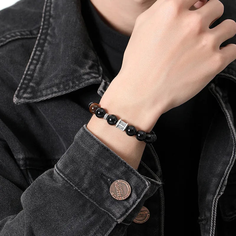 Black obsidian bracelet with silver prayer wheel centrepiece for men