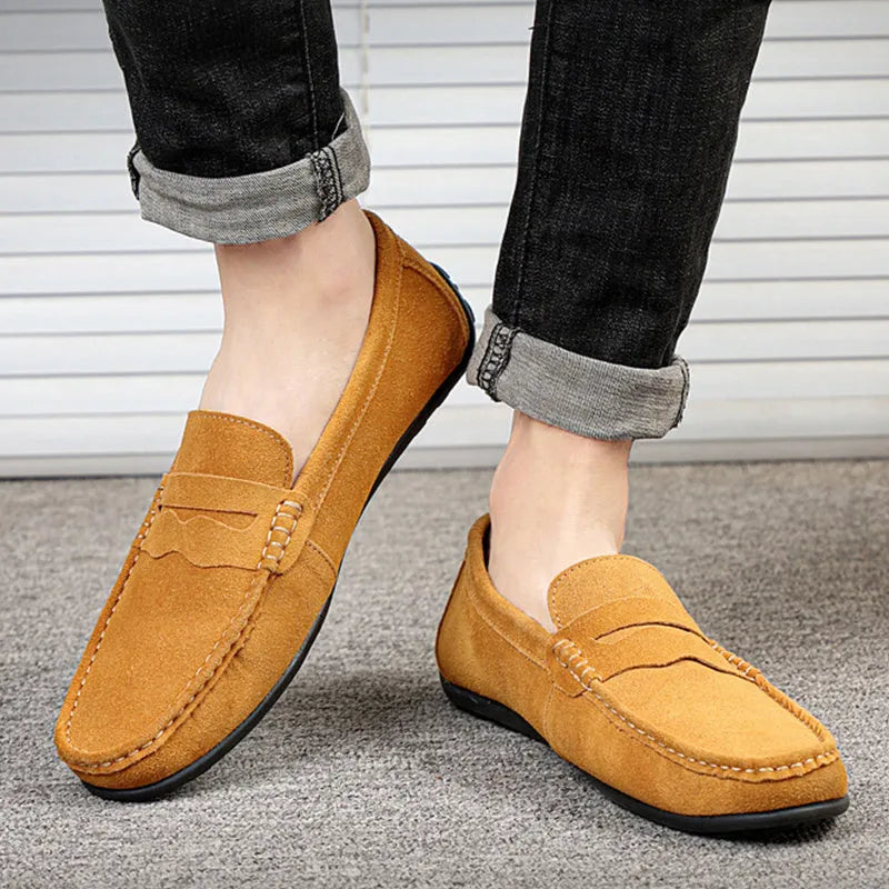 Men's brown suede slip-on loafers with round toe and flat rubber sole
