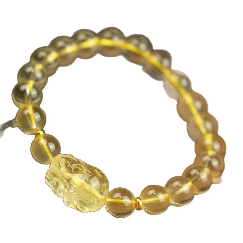 Yellow leather adjustable bracelet with a citrine-coloured artificial crystal Pi Xiu charm.