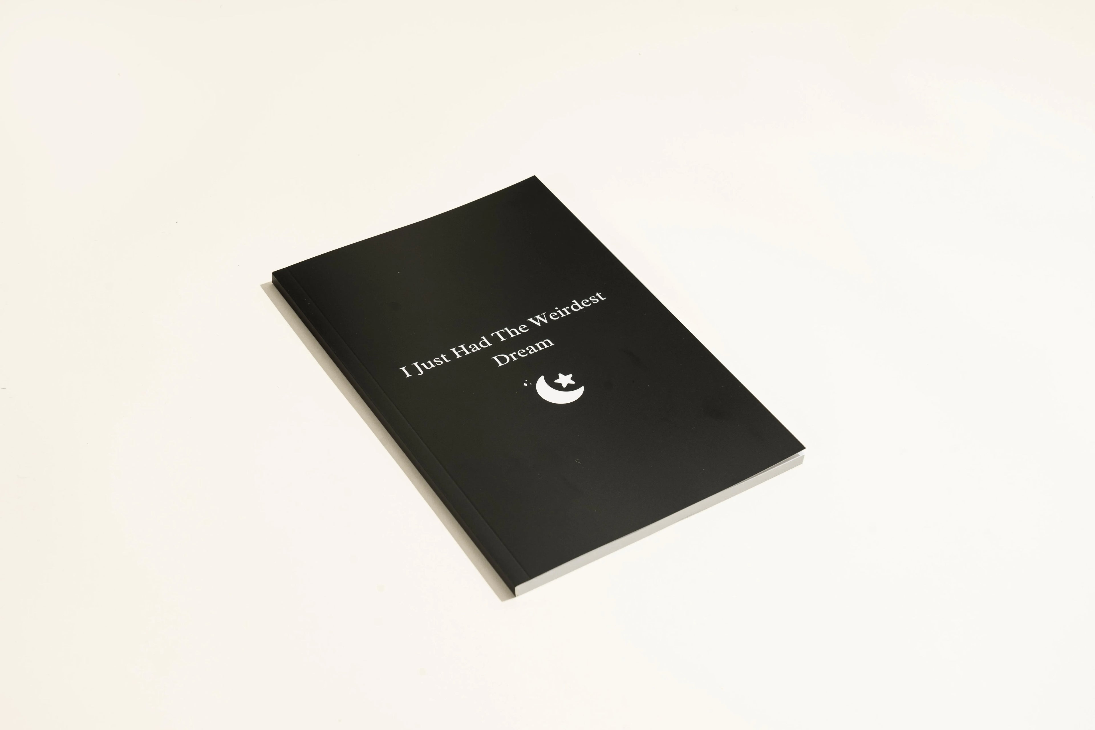 Black hardcover Dream Journal notebook with business simplicity style.