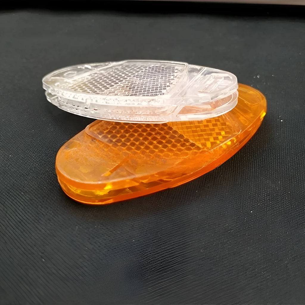 White and yellow bicycle spoke reflectors with plastic construction and night warning film