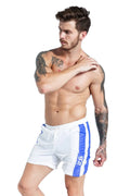 Men's blue polyester sports shorts with slim fit and removable padding for running and table tennis