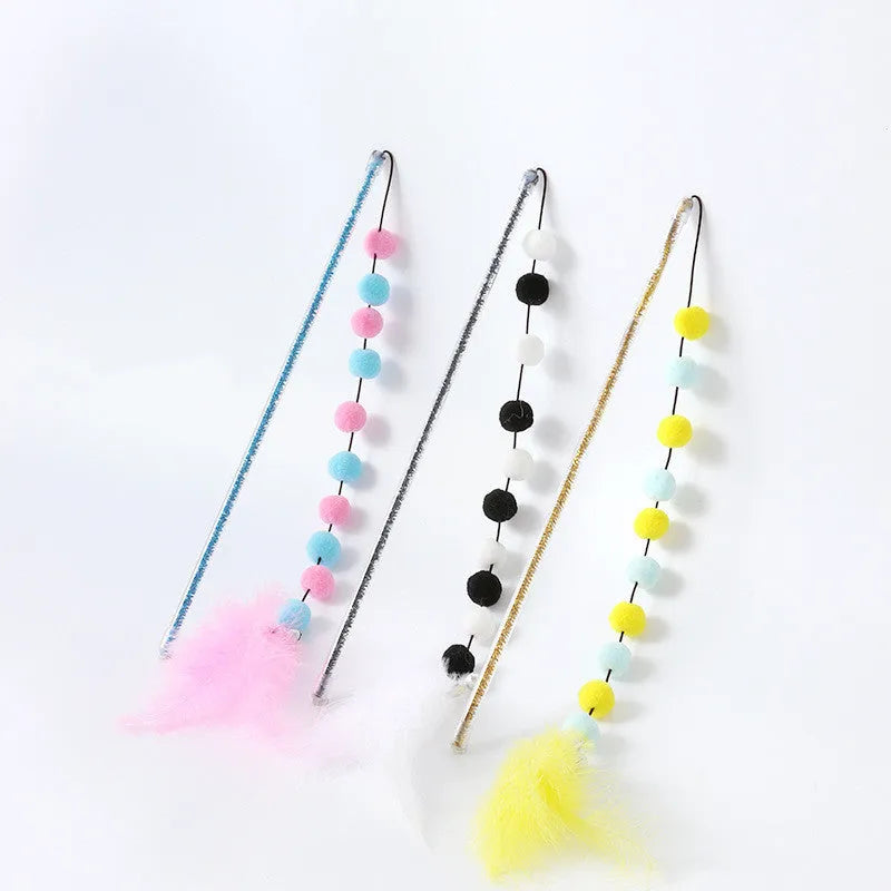 Cat teaser wand toy with plush ball, feathers, and plastic rod, about 31 cm long, random colour
