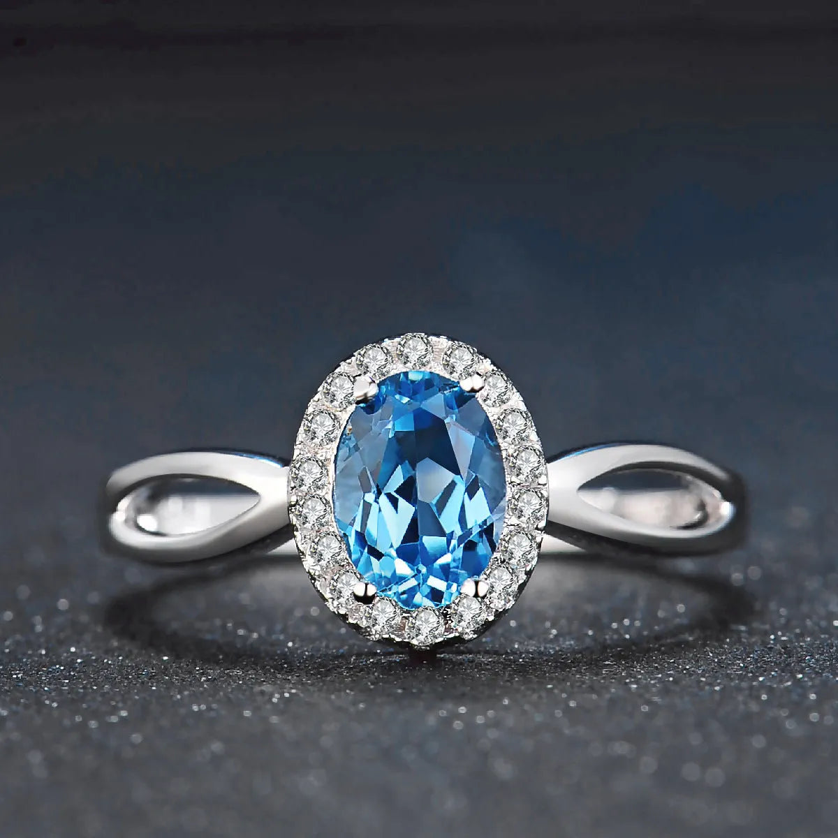 925 sterling silver geometric jewellery set with blue topaz gemstones including earrings, ring, pendant and necklace