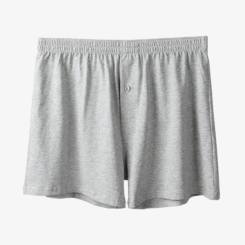 Men's loose fit pure cotton boxer shorts in black, light grey, and navy blue.