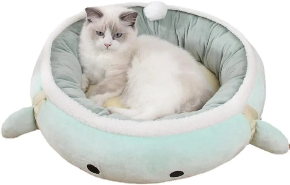 Green chick-shaped cat bed shown both hanging as a hammock and lying flat on the floor.