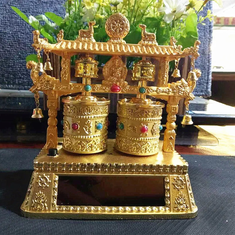 Traditional Chinese alloy prayer wheel car decoration measuring 12x15x8cm with rotating mechanism