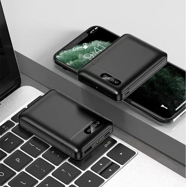 Black and white portable power bank charger with multiple USB ports and compact rectangular design