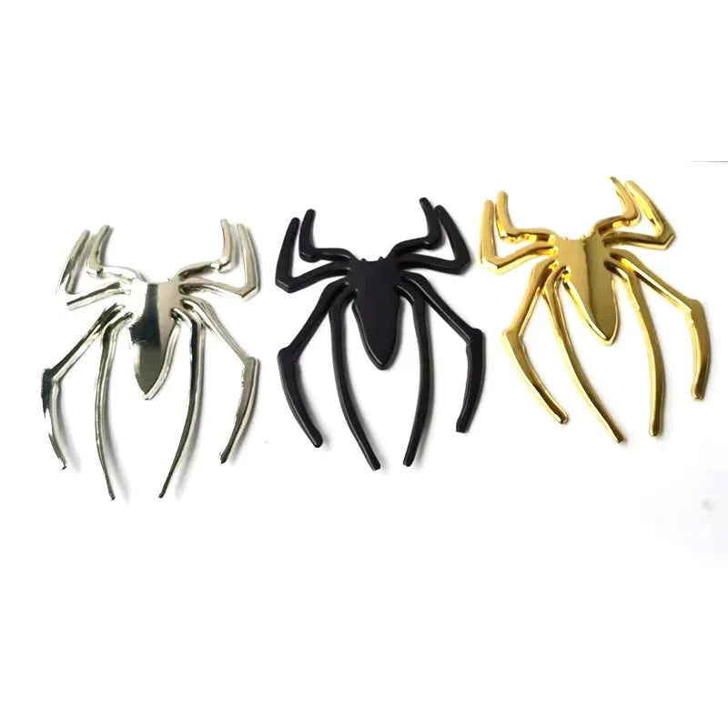 Three-dimensional metal spider car sticker in gold, silver, black, or red.
