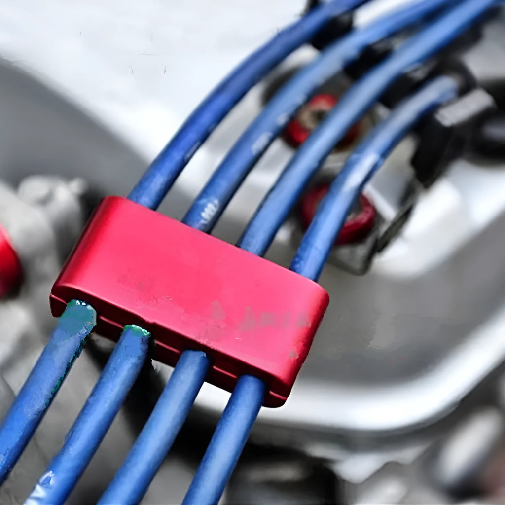 Three-piece metal car fastening clamp for cables and hoses in six colour options.