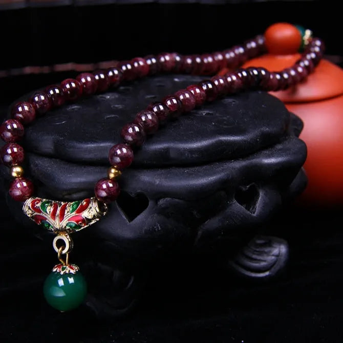 Natural garnet bracelet with 7mm beads, double ring closure and golden toad charm