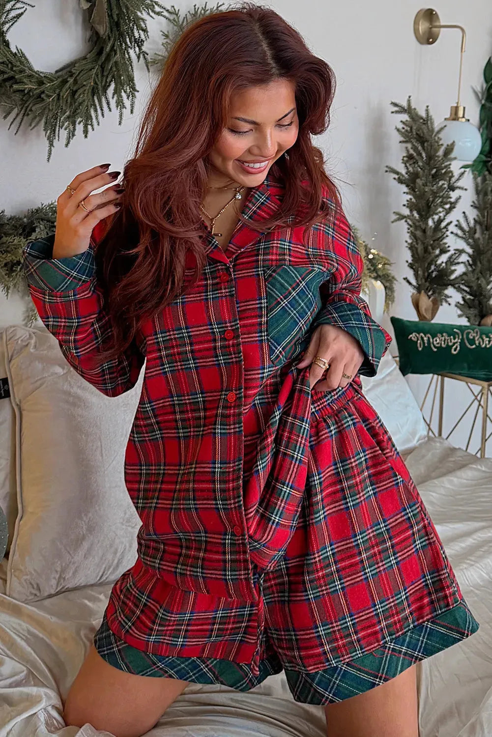 Red plaid Christmas pajama set with long sleeve shirt and shorts featuring contrast patches