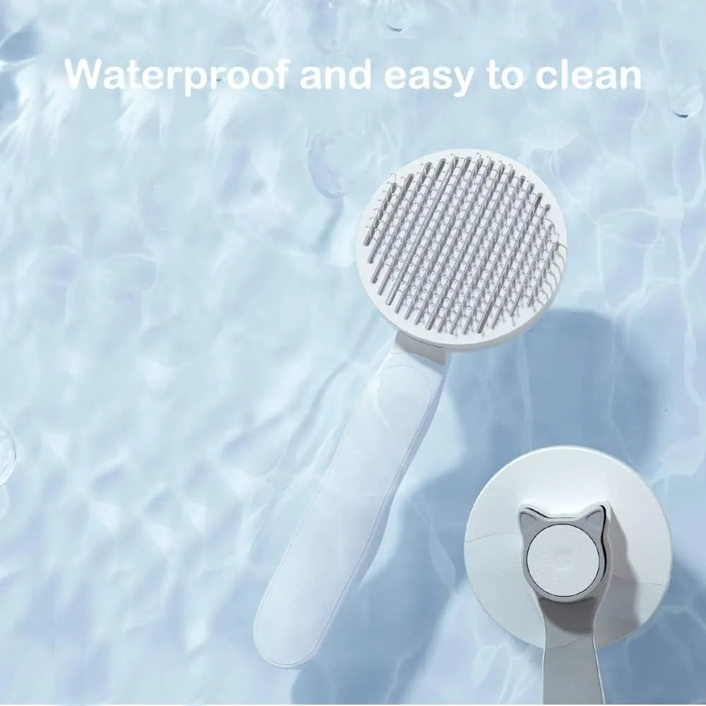 Blue self-cleaning cat brush with rubber-tipped metal pins and a non-slip handle.