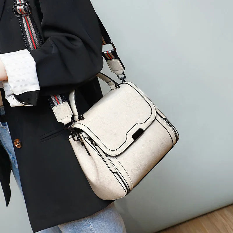 Women's genuine leather retro messenger bag in horizontal square shape with multiple interior compartments