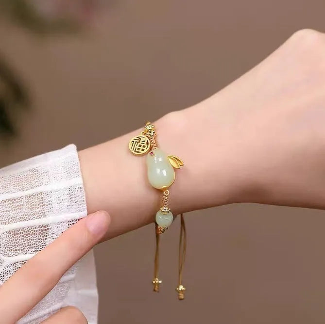 Hetian jade rabbit bracelet with geometric charm on yellow adjustable string