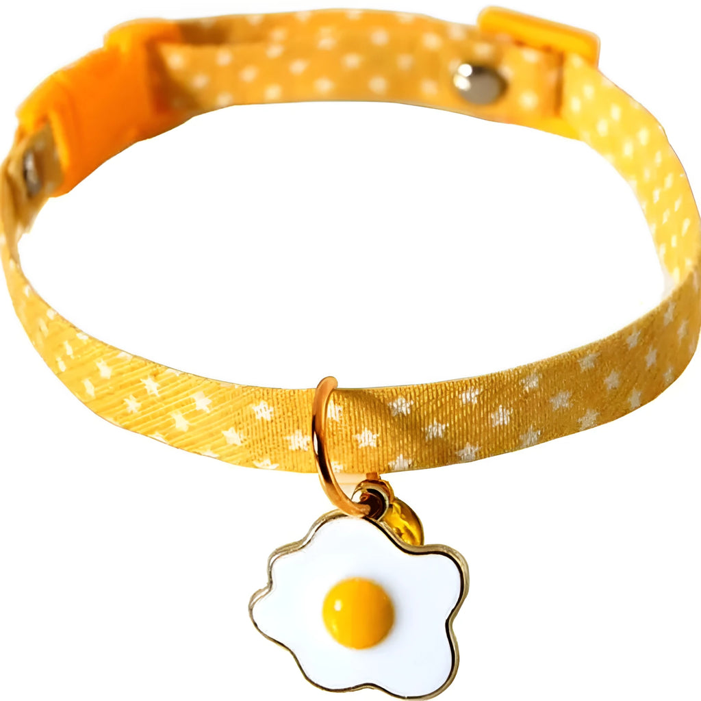 Green adjustable cat collar with metal bell pendant and matching bow tie accessory for small pets
