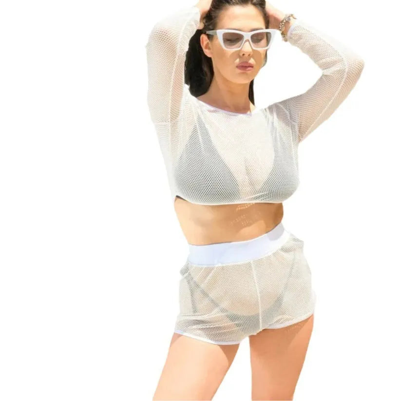 White transparent women's two-piece beach swimsuit set with a top and skirt on a mannequin.