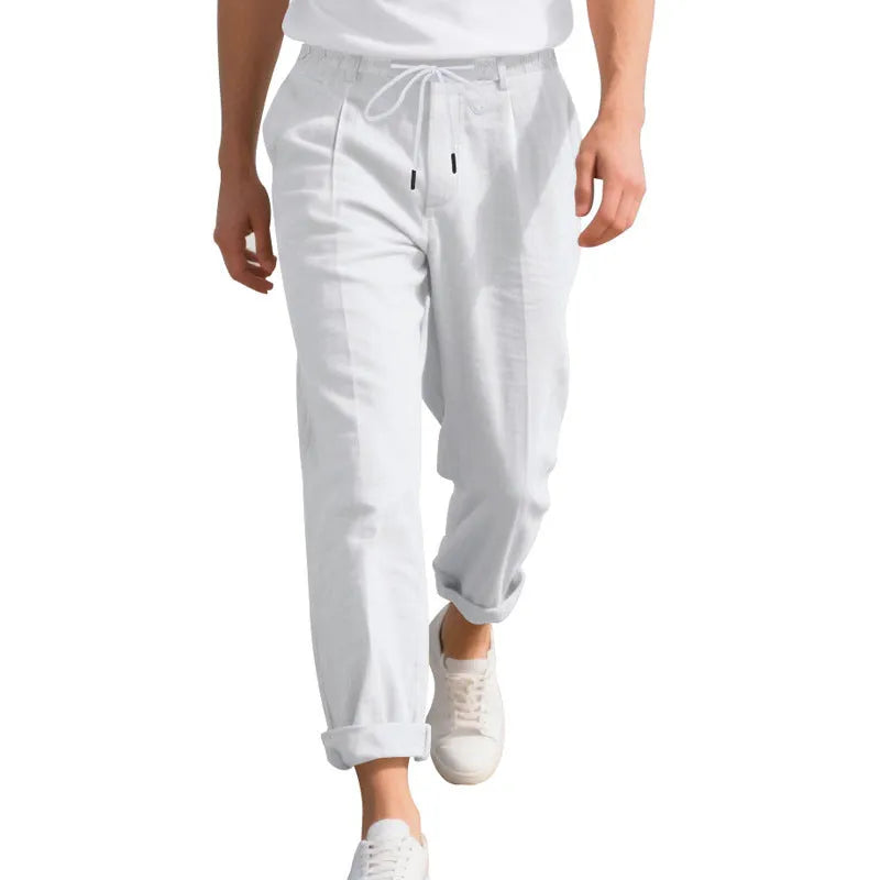 Men's light khaki linen casual trousers with a drawstring waist and straight leg fit.