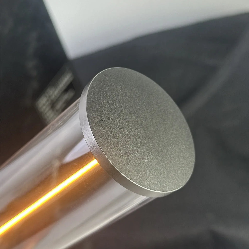 Modern glass LED light strip with magnetic back, measuring 234mm high, on a metal surface.