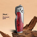 Metal folding knife lighter in camouflage finish showing unfolded blade and jet flame