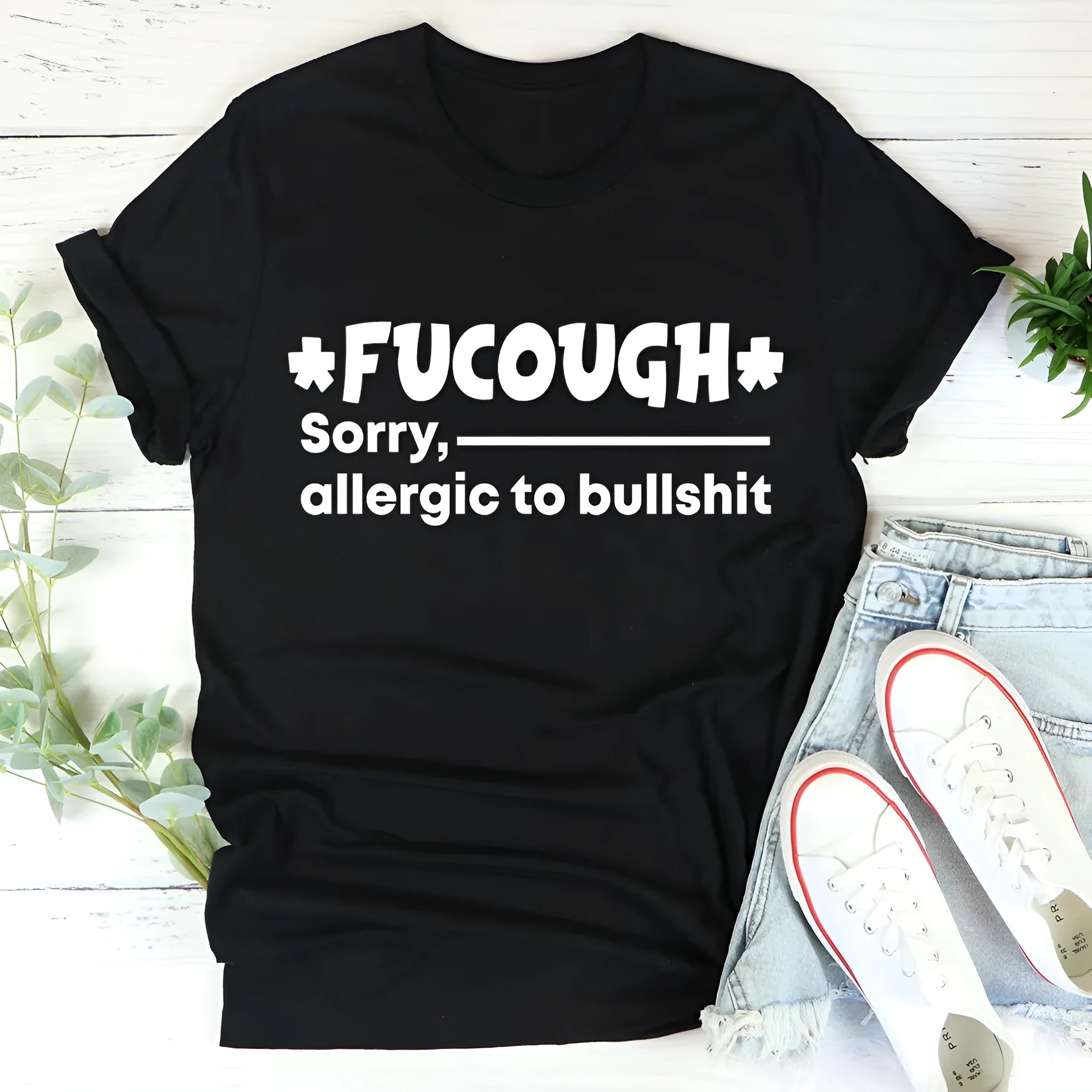 Black loose fit cotton summer T-shirt with short sleeves and round neck on hanger