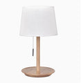 Walnut colour solid wood table lamp with a white cloth shade and a black cable switch