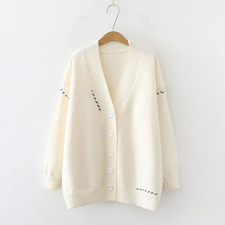 Women's loose fit knitted cardigan top coat in black or white with long sleeves