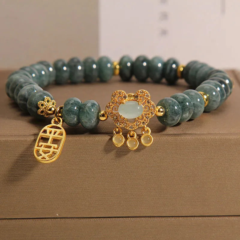 Women's bracelet with natural emerald jade abacus beads and alloy safety lock closure