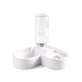 White pet water fountain with stainless steel top, showing water flowing from the centre.