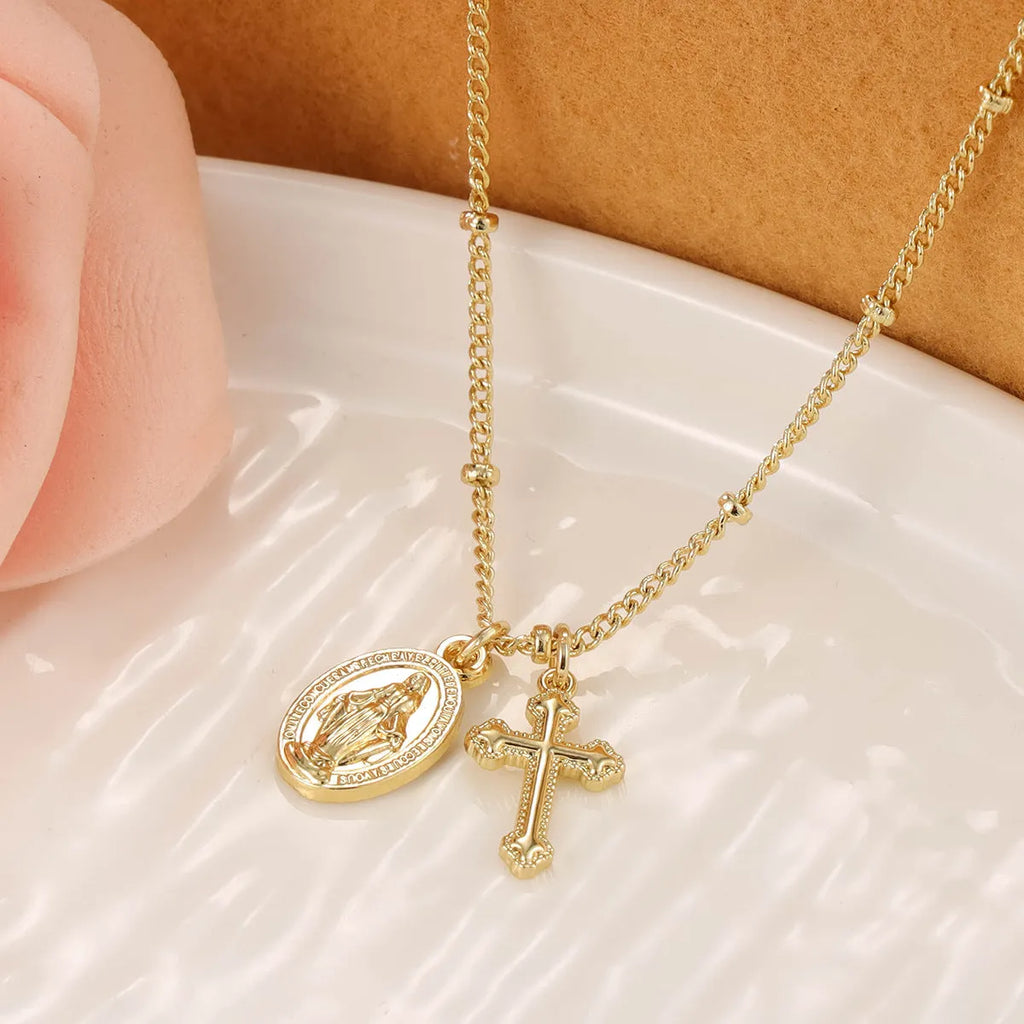 Gold Virgin Mary necklace with geometric cross pendant on copper with 18K plating