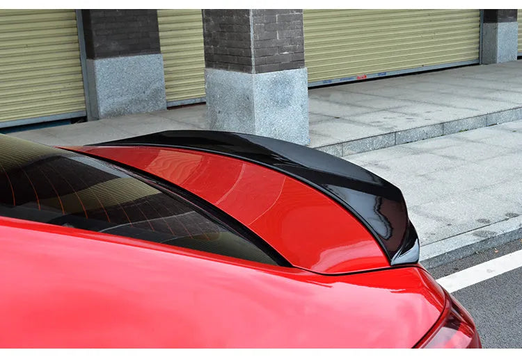 Bright black Mazda 3 tail trim accessory for 2014-2021 Axela Exela models with large fixed blade design