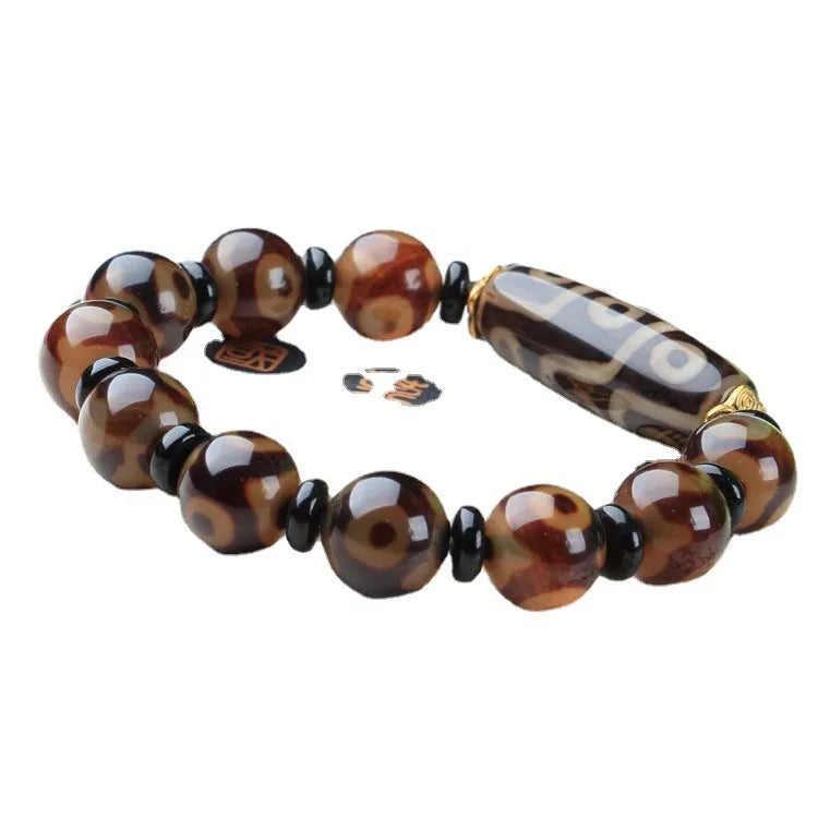 Handmade distressed agate dzi bead bracelet with polished Tibet beads on wrist