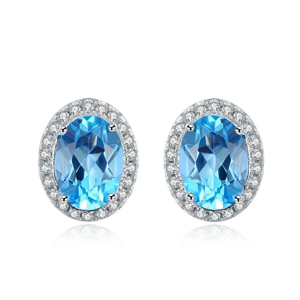 925 sterling silver geometric jewellery set with blue topaz gemstones including earrings, ring, pendant and necklace