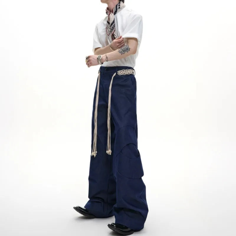 Men's dark blue loose fit straight leg jeans with zipper decoration and belt stitching detail.