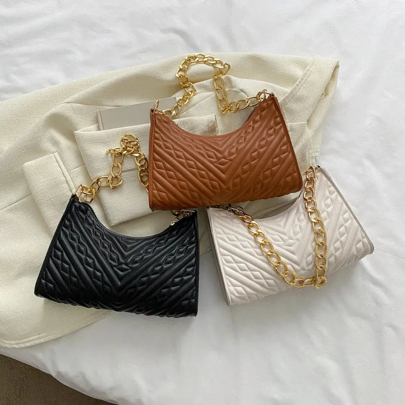 Brown PU pleated chain baguette shoulder bag showing vertical square shape with sewing line detailing
