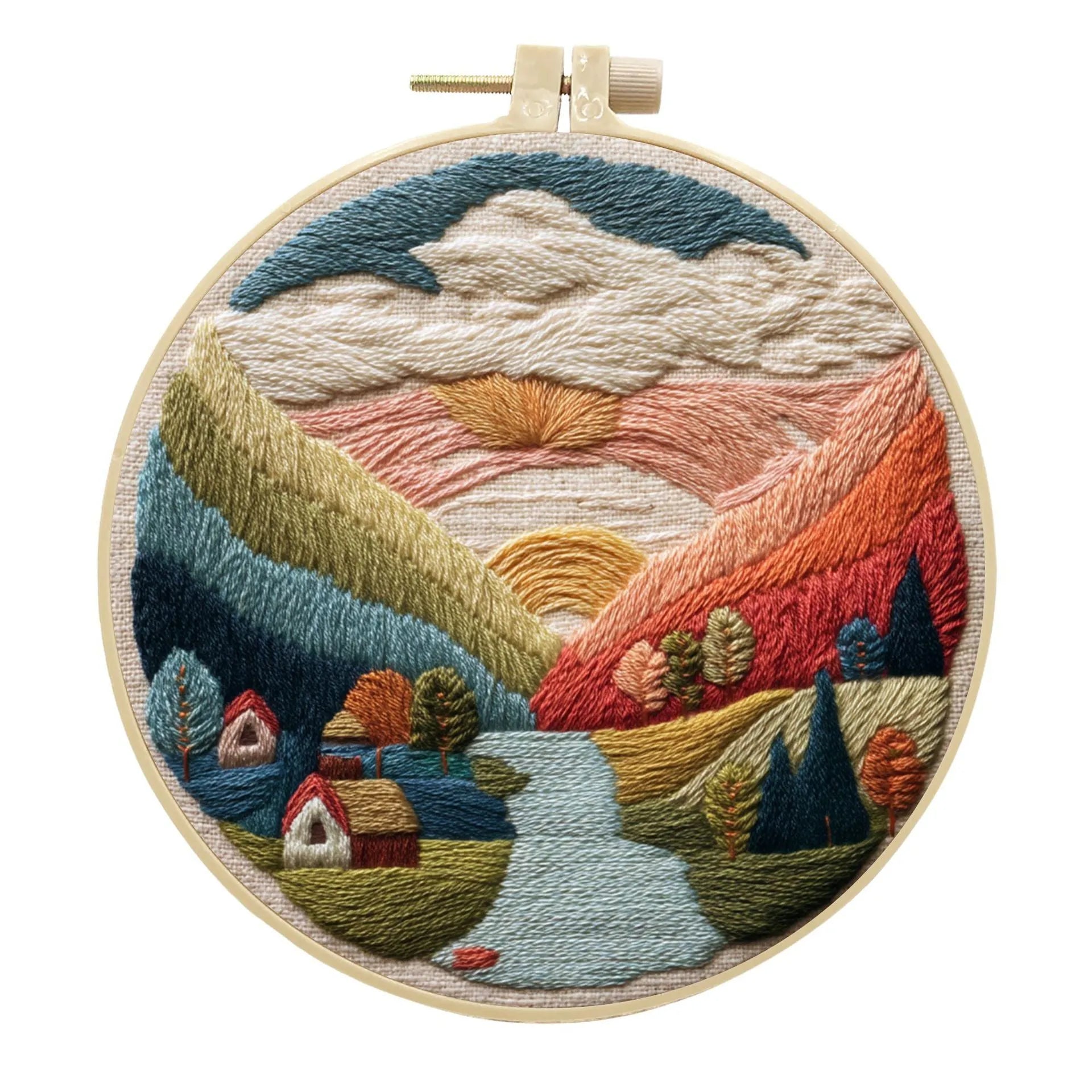 DIY landscape embroidery kit with bamboo frame, printed fabric, and thread on a table