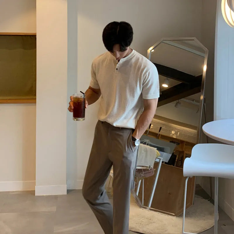 Men's black slim-fit ice silk knitted short-sleeve pullover shirt on a hanger.