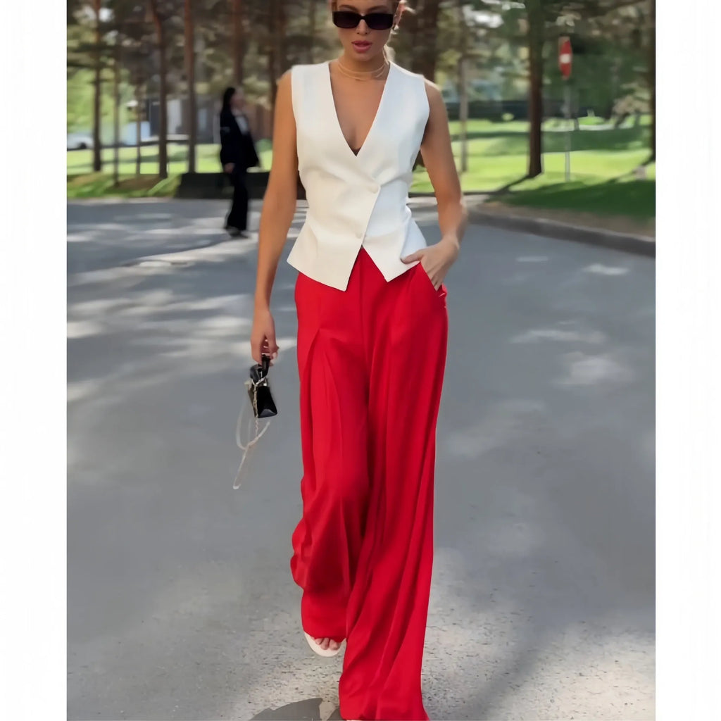 Women's beige two-piece set with deep V-neck sleeveless top and high-waist wide-leg trousers