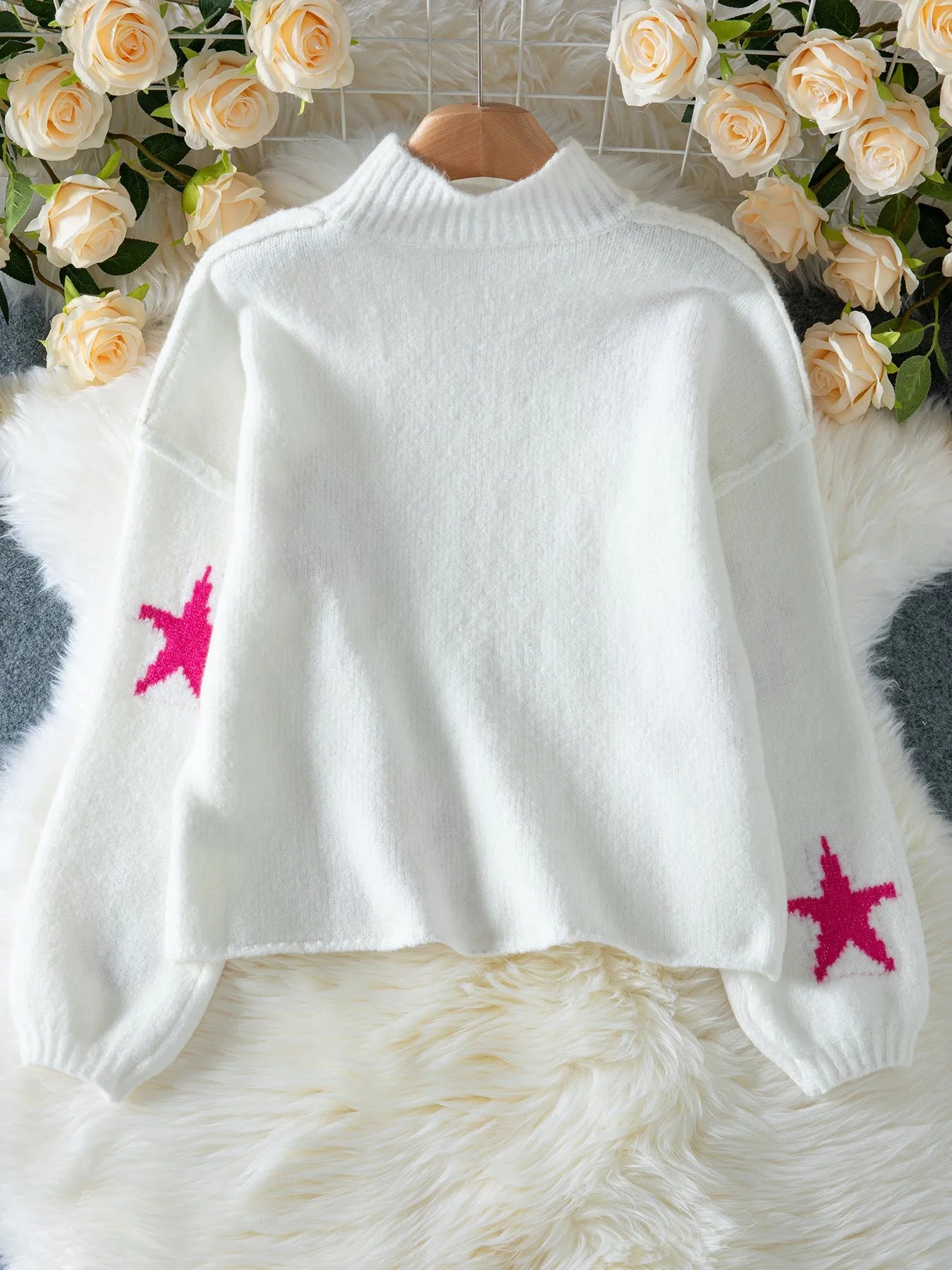 Women's white turtleneck pullover with five-pointed star pattern and loose fit design
