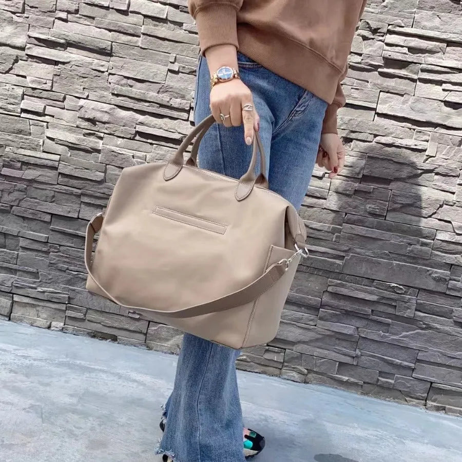Nylon waterproof cloth shoulder bag in black or light khaki with 35cm length and polyester lining