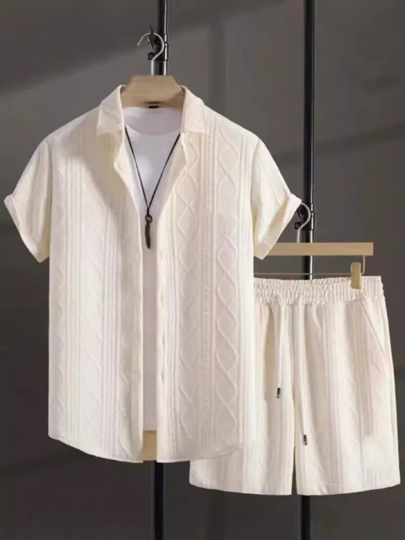 Mens black and white jacquard short sleeve shirt and matching shorts suit set on a hanger.