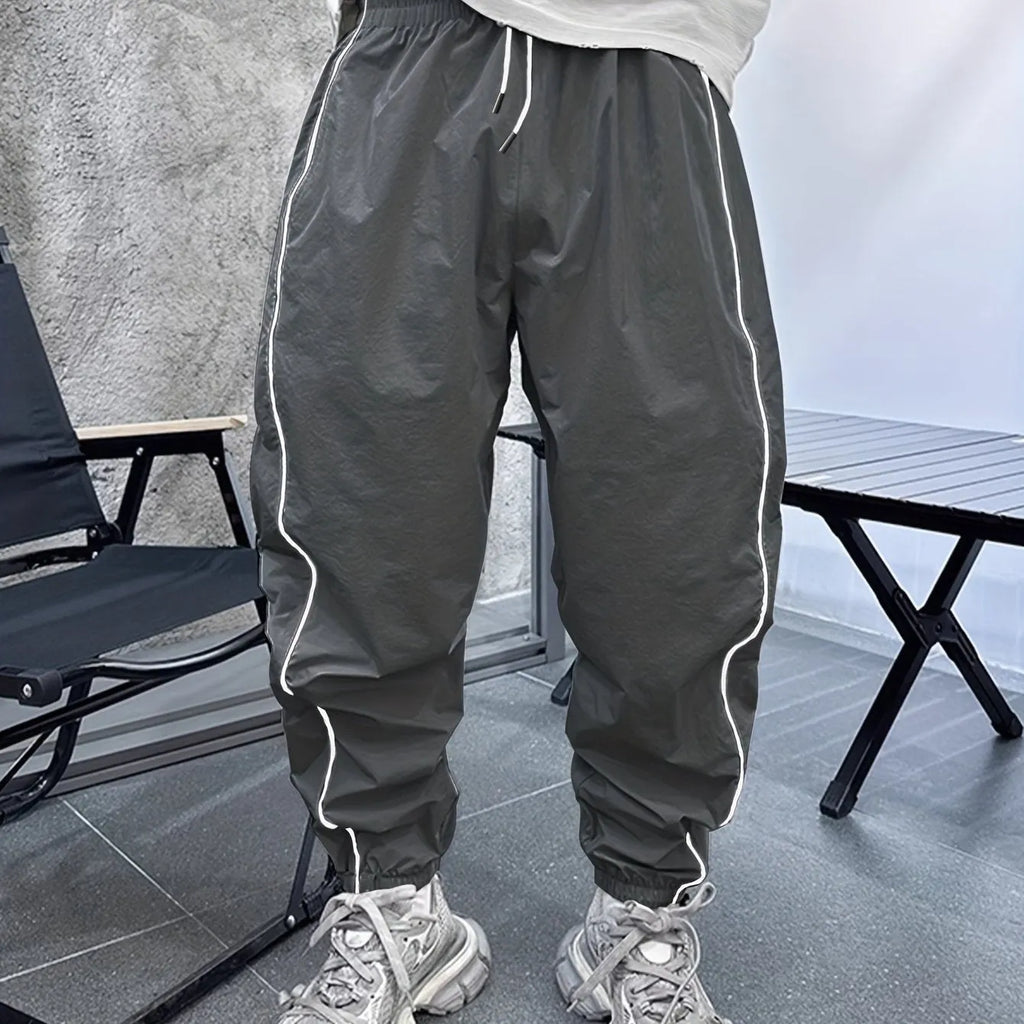 Men's loose fit bamboo fibre sports trousers in Army Green colour showing cropped length design