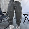 Men's loose fit bamboo fibre sports trousers in Army Green colour showing cropped length design