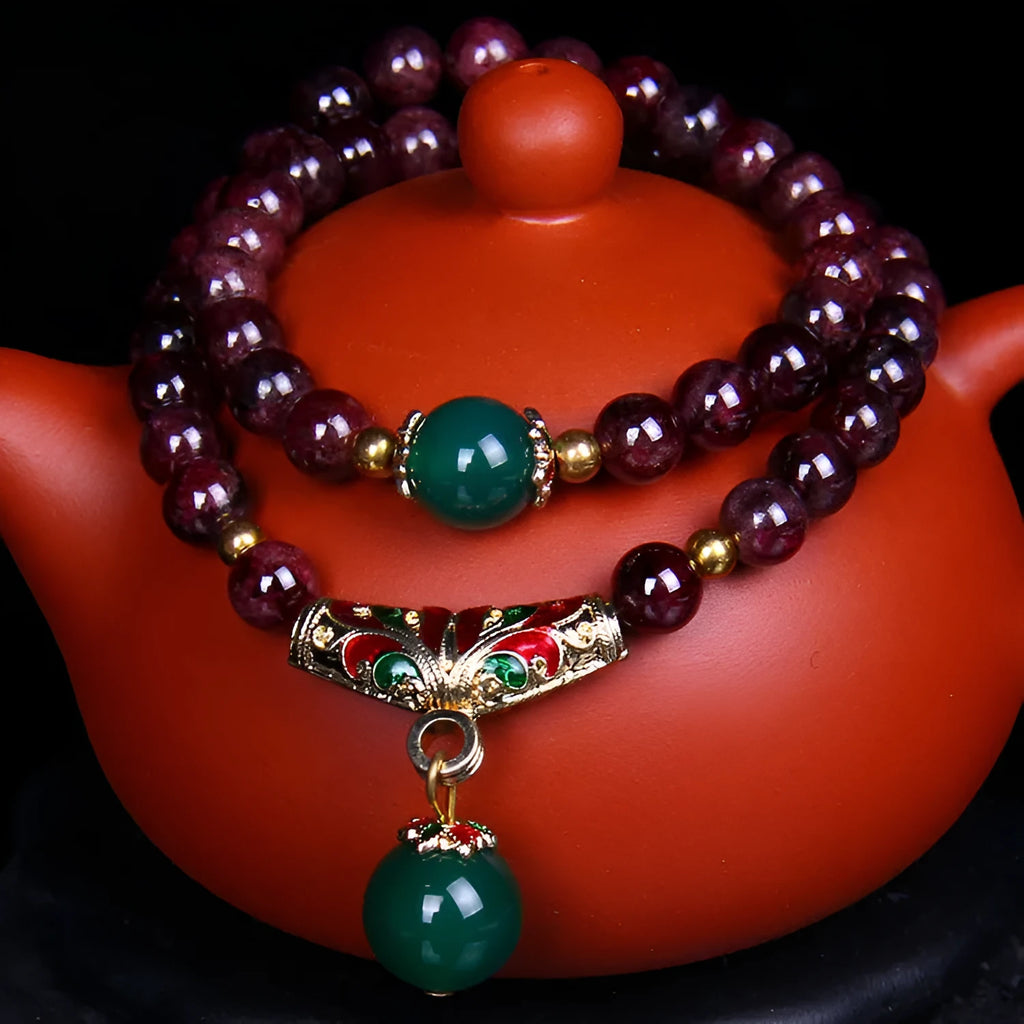 Natural garnet bracelet with 7mm beads, double ring closure and golden toad charm