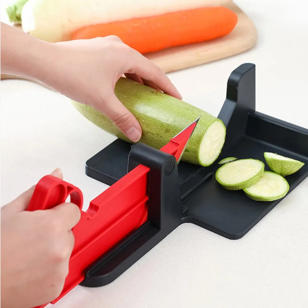 Green manual vegetable cutter with stainless steel blades for chopping carrots and potatoes