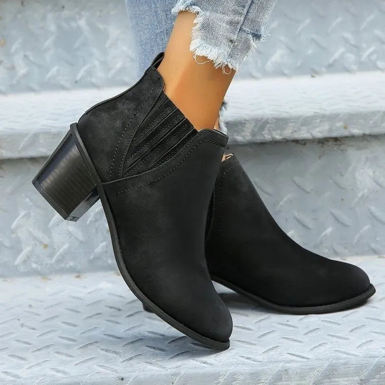 Women's black pointed toe ankle boots with thick square low heel and slip-on design