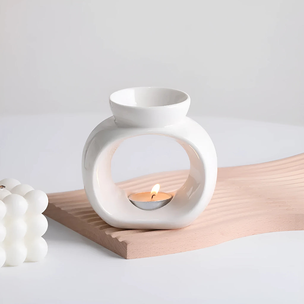 White Nordic style ceramic aromatherapy stove ornament on a tabletop