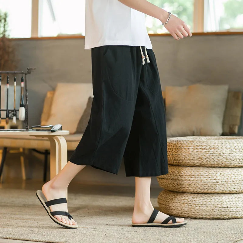 A pair of straight cut skinny leg linen shorts in a choice of five colours, shown on a hanger.