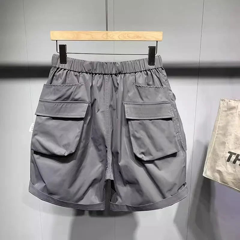 Men's large size workwear shorts in black with pockets and straight leg hem